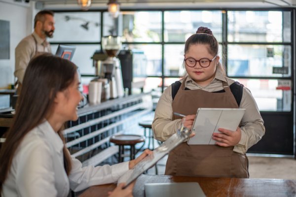 Autistic girl working in her family's coffee shop